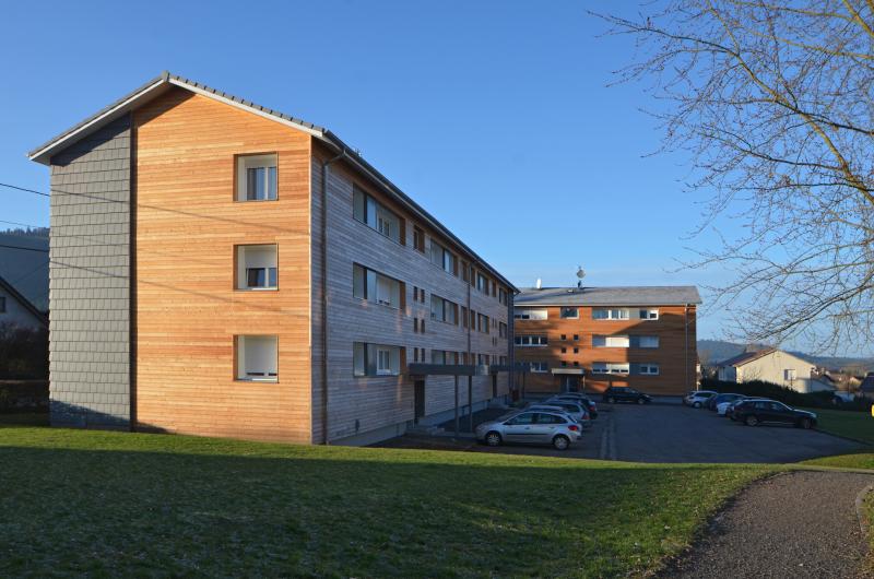 PhotoRénovation énergétique facteur 10, biosourcée et 100% ENR d'un ensemble de 24 logements
