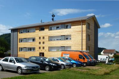 PhotoRénovation énergétique facteur 10, biosourcée et 100% ENR d'un ensemble de 24 logements